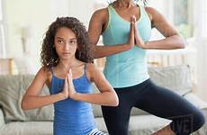 yoga daughter mother poses doing living room dissolve stock tetra d1028
