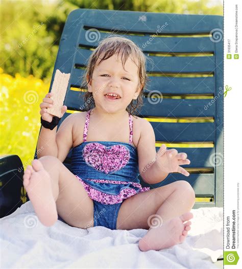 Massage, nuru, nuru massage mom. Toddler Girl Sitting On Sun Lounger Stock Image - Image ...