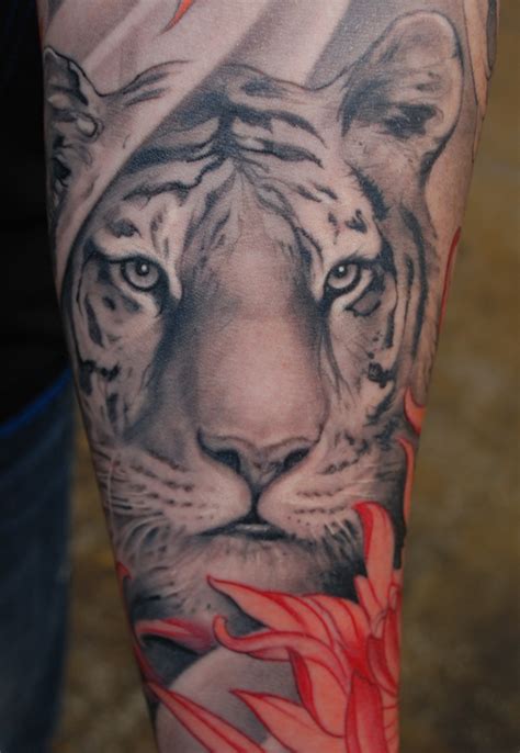 Lion with cub tattoo on man chest. Tiger Tattoo Designs For Men ~ All About