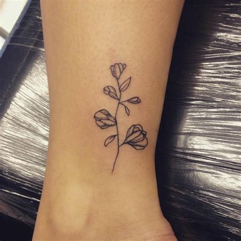 Sweetpea baking company, herbivore clothing Ankle tattoo of a sweet pea.