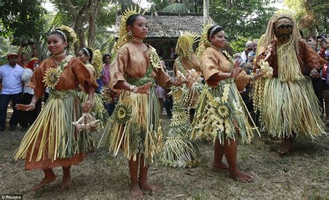 Malaysia's also having a mixed heritage. Malaysian villagers don intricate traditional costumes and ...