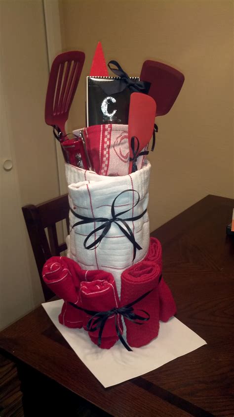 Great christmas gifts for the kitchen. Kitchen Utensil "Cake" Bridal Shower Gift--CUTE just sayin ...