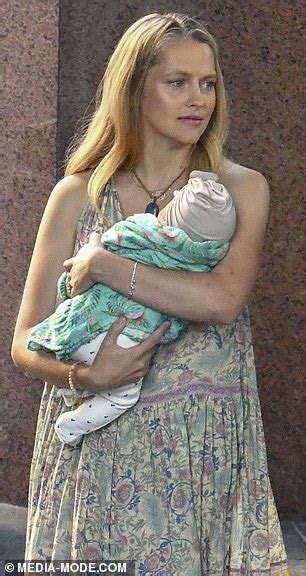 Maybe you would like to learn more about one of these? Teresa Palmer appears happy and relaxed as she cradles her ...