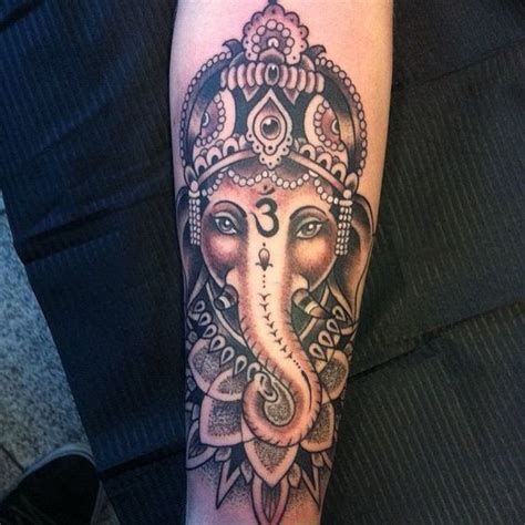 Lord ganesh and apple logo tattoo. 50 Amazing Lord Ganesha Tattoo Designs and Meanings ...