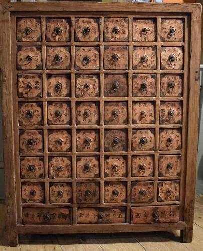 The drawers have the original brass pulls and are hand dovetailed. Antique Chinese Apothecary Cabinet in FURNITURE