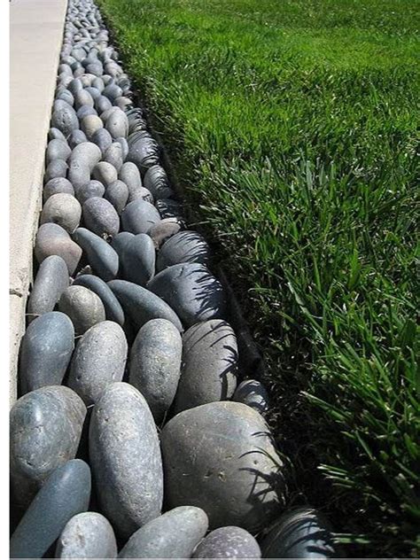 River rock borders large river rocks or cobblestones are an ideal lawn replacement. Rock Edging | Outdoor gardens, Garden edging, Backyard
