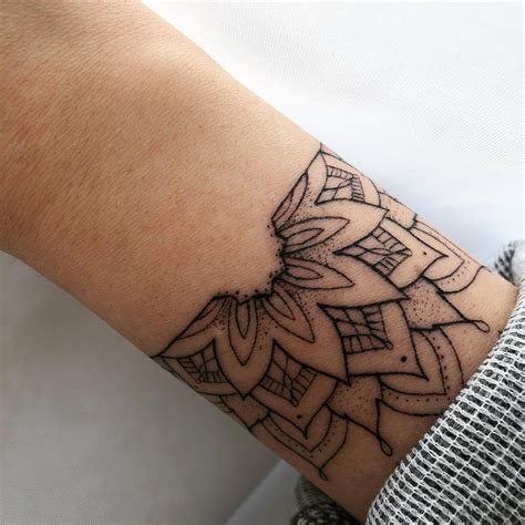 The designs generally take the shape of a circle which is created from the center towards the edges and are simply spectacular. Wrist Tattoo #wristtattoo | Hand tattoos for guys, Mandala ...