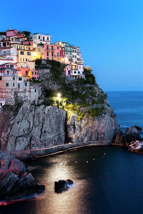 Cinque terre and bussana vecchia liguria has many well preserved old villages that tend to line the coastal regions. Manarola Cinque Terre At Night, Liguria Photograph by Pidjoe
