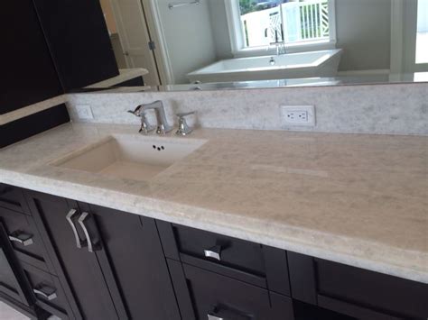 The simple transitional style of this vanity is the perfect fit for any bathroom update. Electrical outlet in backsplash | Bathroom backsplash ...