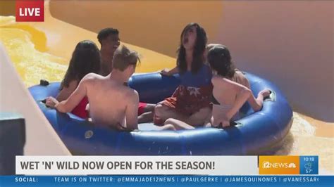 A stuntman slides down the slide, secured by a rope. Monica Garcia braves Wet 'n' Wild water slide on opening ...