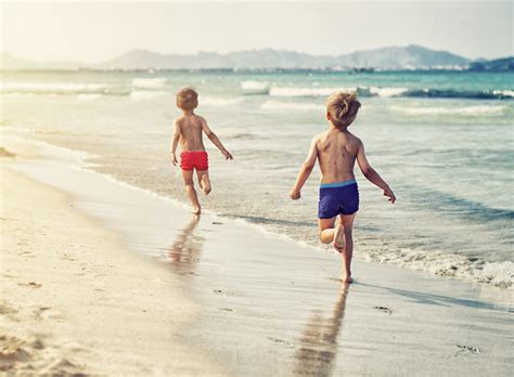 Kids playing with balloons at the beach. Parents arrested for letting kids play on the beach alone ...