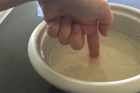 Make a bath pad by putting a clean towel on top of a folded wet baby's head with clear water. Topping And Tailing: All You Need To Know - Baby Bath Moments