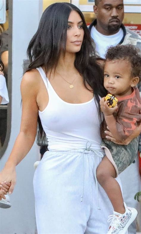 Kim realised that her toddler has hacked into her account yet again and posted: Kim Kardashian goes braless for her bambinis birthday ...