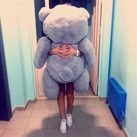 Cute blonde gets a huge birthday present! top, huge, teddy bear, human size, grey, present, gift ...