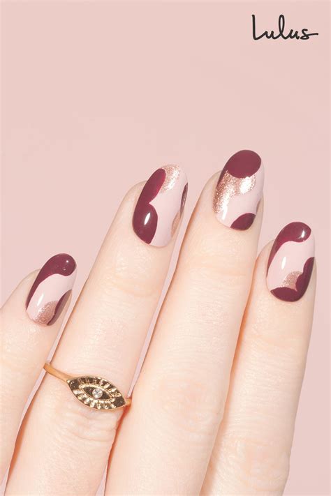 We're definitely going to be trying this! Valentine Nail Idea: Burgundy & Rose Gold Nails | Gold nails, Rose gold nails, Camo nail designs