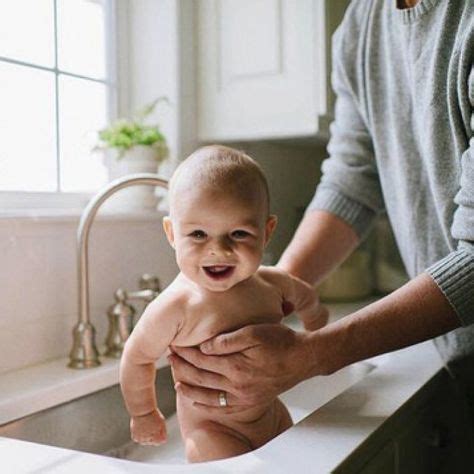 A monkey in a sink puts his hands under the faucet and begins to wash the soap off of his face as the water continues to run. sink bath time | Little babies, Baby photography, Baby ...