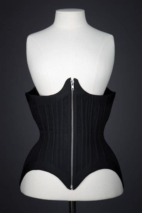 A corset is a garment worn to hold and train the torso into a desired shape, traditionally a smaller waist or larger bottom, for aesthetic or medical purposes (either for the duration of wearing it or with a more lasting effect), or support the breasts. 'Black Moon' Underbust Corset By Grace Horne | The ...