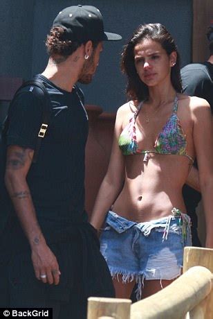 Neymar is a brazilian professional player who plays for the ligue 1 french club, paris saint germain. Neymar kisses girlfriend Bruna Marquezine in Brazil ...