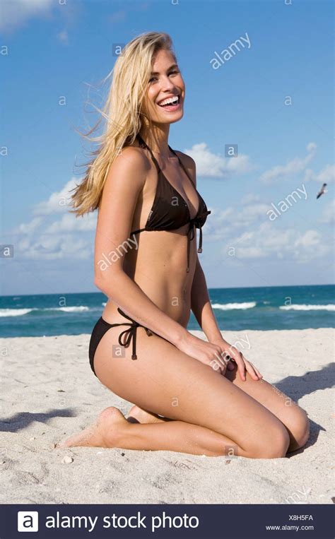 Going from a dark brunette to blonde is a drastic change, but also one that's fun and definitely doable. Female very long blonde hair wearing brown bikini kneeling ...