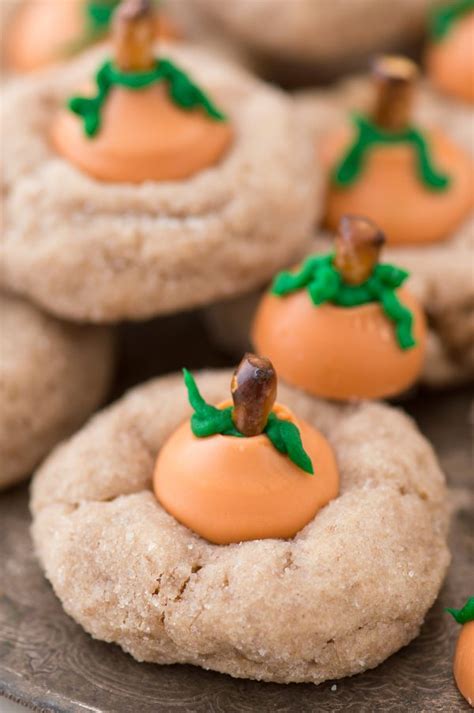 These easy strawberry cookies are topped with a truffle kiss hershey kiss and sparkles. Pumpkin Blossom Cookies