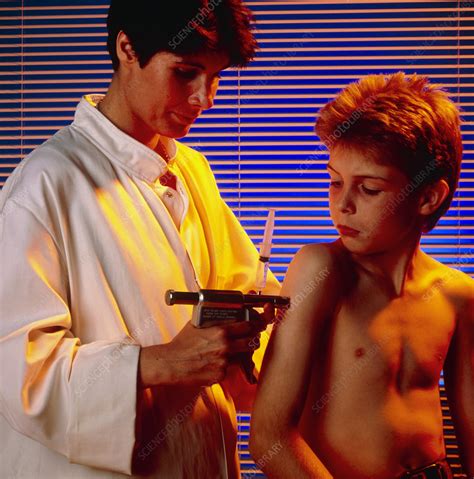 4, he elaborated on the rigorous quality control process that the authorities had put. Doctor uses a vaccine gun to inject a young boy - Stock ...