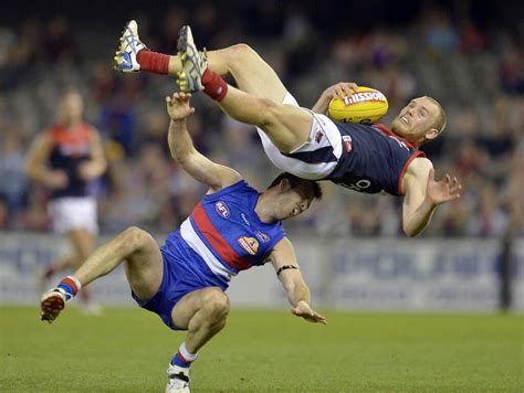 Find official afl balls, team themed footballs, sherrin footballs & more. Player marks ball in Australian rules football ...