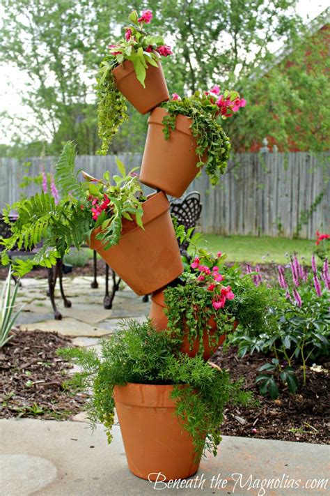 Find a wide selection of plant stands at great value on athome.com, and buy them at your local at show off your greenery with plant stands and tables. Adorable terra cotta pots | Plant stand, Stacked pots ...