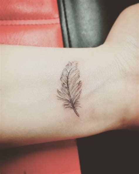 Here is one more small but cute idea for the. Image result for best small feather tattoos # ...
