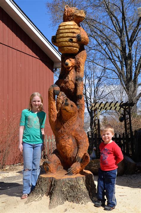 Serves as the symbol of. Naperville's new totem pole depicts three bears, stands ...