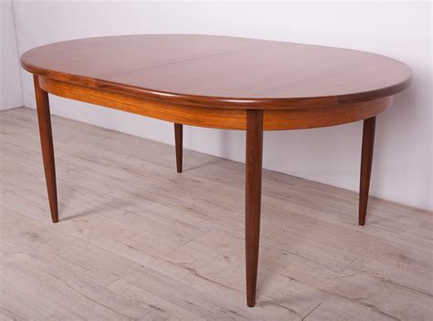 To clean teak, use either a manufacturer's suggested product or try a 2:1 ratio of laundry detergent with bleach and water, applied with a soft bristle brush. Mid-Century Teak Dining Table from G-Plan, 1960s | #152120