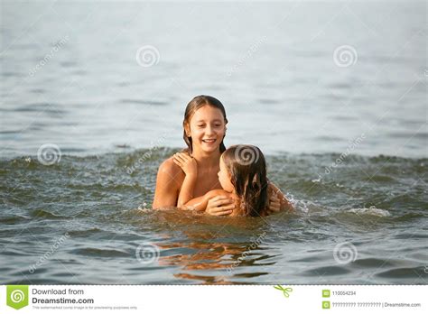 The beach boys 2012 live in japan full show. Girls Sisters Have Fun Bathing In The Sea Stock Photo ...