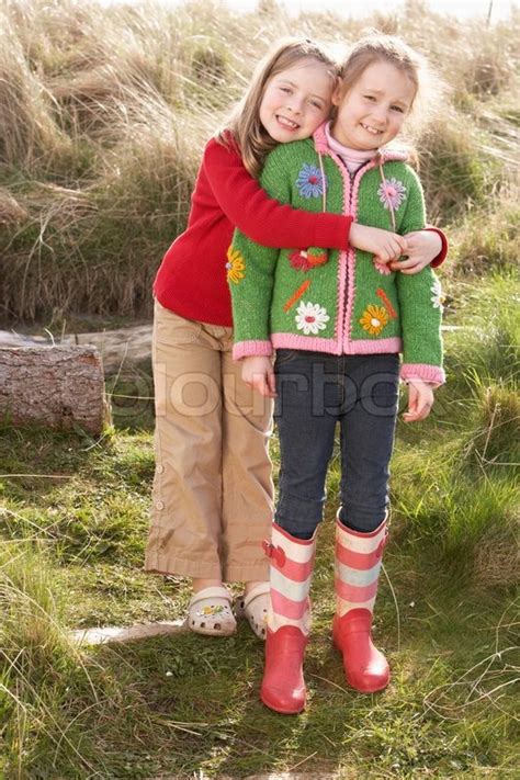 Girls playing together free photo. Young Girls Playing In Field Together | Stock Photo ...