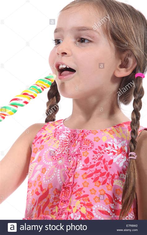 Check out our small petite teen selection for the very best in unique or custom, handmade pieces from our shops. Little girl with multicolored lollipop Stock Photo ...