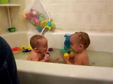 These days, plastic or foam tubs give parents a convenient spot to prop floppy newborns and keep more curious older babies. The twins lose it in the tub! - YouTube