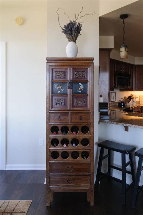 Another great way of repurposing an old wooden hutch is by turning it into a gorgeous wine station. Oriental China Cabinet With Wine Storage | HGTV