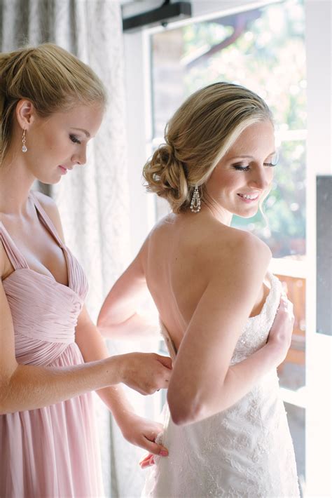 Wedding dress cleaning and preservation. Bride Putting on Wedding Dress