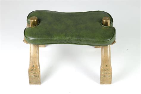 When my folks opened their 'used furniture & antiques' shop in '71 here in florida, one of the lots bought at auction included a number of similar camel saddle stools, recall that they. 20th century wood, etched brass & leather Egyptian camel ...