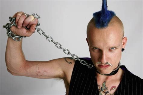 Cool, scary, freakish or beautiful? Body Modification Addict Gets Tusks Over His Teeth!