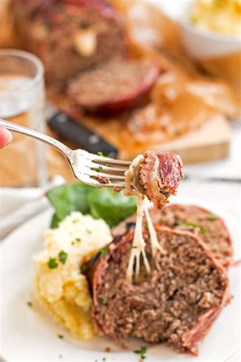 Serve with buttery jacket potatoes for a comfort food supper. The BEST homemade meatloaf recipe! Stuffed with cheese and ...