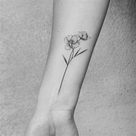Miserere nobis are latin words which means have mercy on us. Cute flower wrist tattoo | Wrist tattoos girls, Flower ...