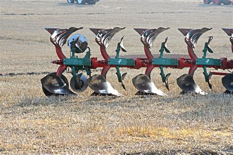 Both /plaʊ/) is a farm tool for loosening or turning the soil before sowing seed or planting. Avebury & District Ploughing Association