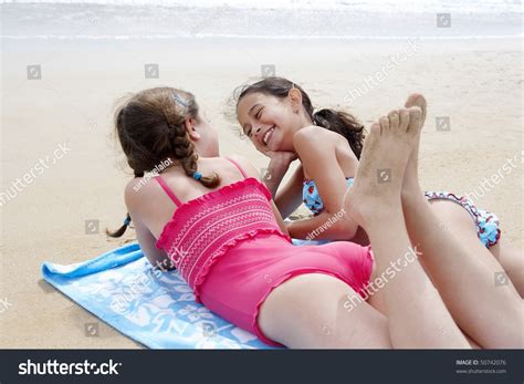 Pigs (piglet & sow) & teen girls in the exuma islands in the bahanas. Preteen Girls Lying Side By Side Stock Photo 50742076 ...