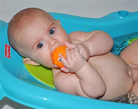 Six month old babies are just learning how to crawl. Baby Baker Love: bath time baby.