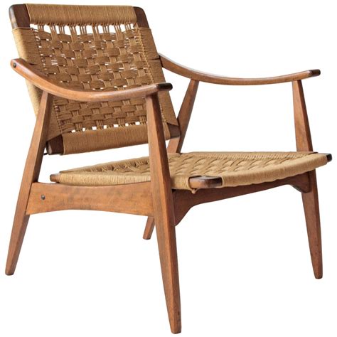 Pair of handsome mid century modern rope chairs. Hans Wegner Style Woven Rope Chair at 1stdibs