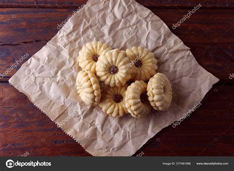 Stir in flour and chopped almonds. Austrian Jelly Cookies : Classic Thumbprint Cookies ...