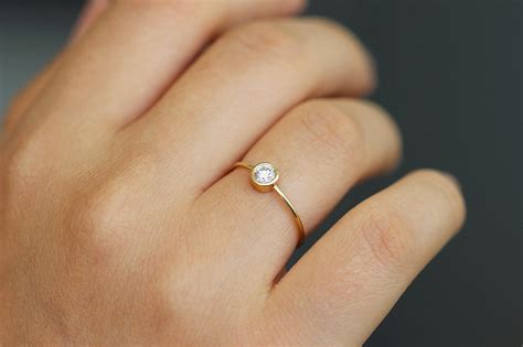 Maybe you would like to learn more about one of these? Simple Engagement Ring - Round Diamond - 0.2 Carat - ARTEMER