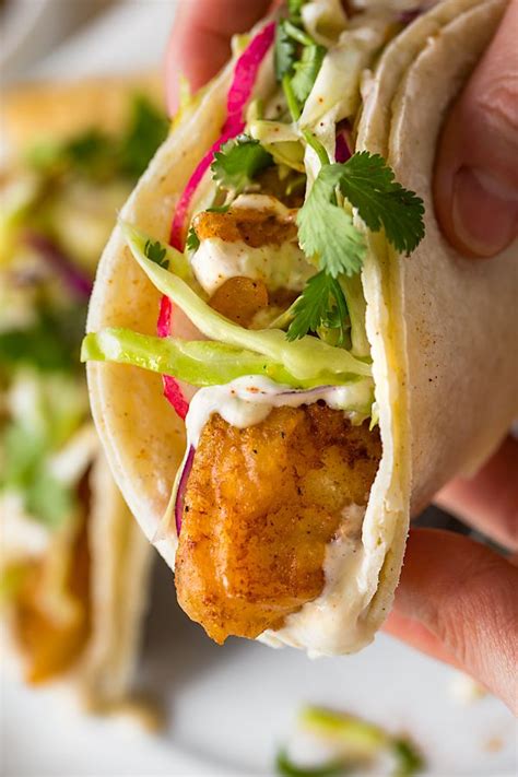 Before becoming a food writer make a spicy slaw with shredded green cabbage, mayo, cayenne pepper, and lime juice, and serve it on top of the fish tacos. Baja Fish Tacos with Citrus Slaw | The Cozy Apron | Recipe ...