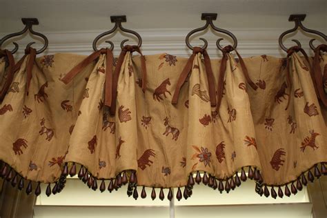 I was thinking the rule of thumb is go to the ceiling. Love the hooks hanging from the ceiling on this valance ...