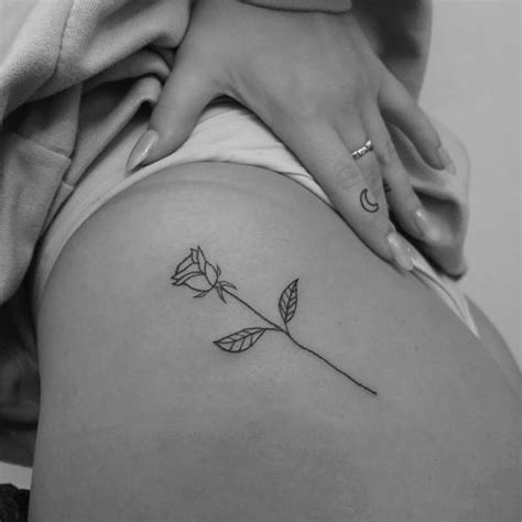 White roses are more mysterious, with sacred connotations and a spiritual meaning. Anne-Marie Rose Hip Tattoo | Steal Her Style