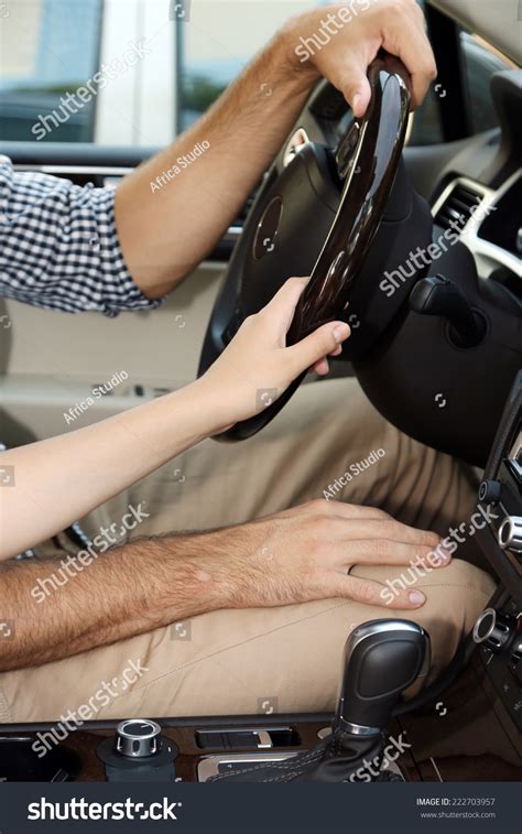 Selective focus of couple holding hands and walking on shore near the sea during road trip. Loving Couple Holding Hands In Car Close-Up Stock Photo ...